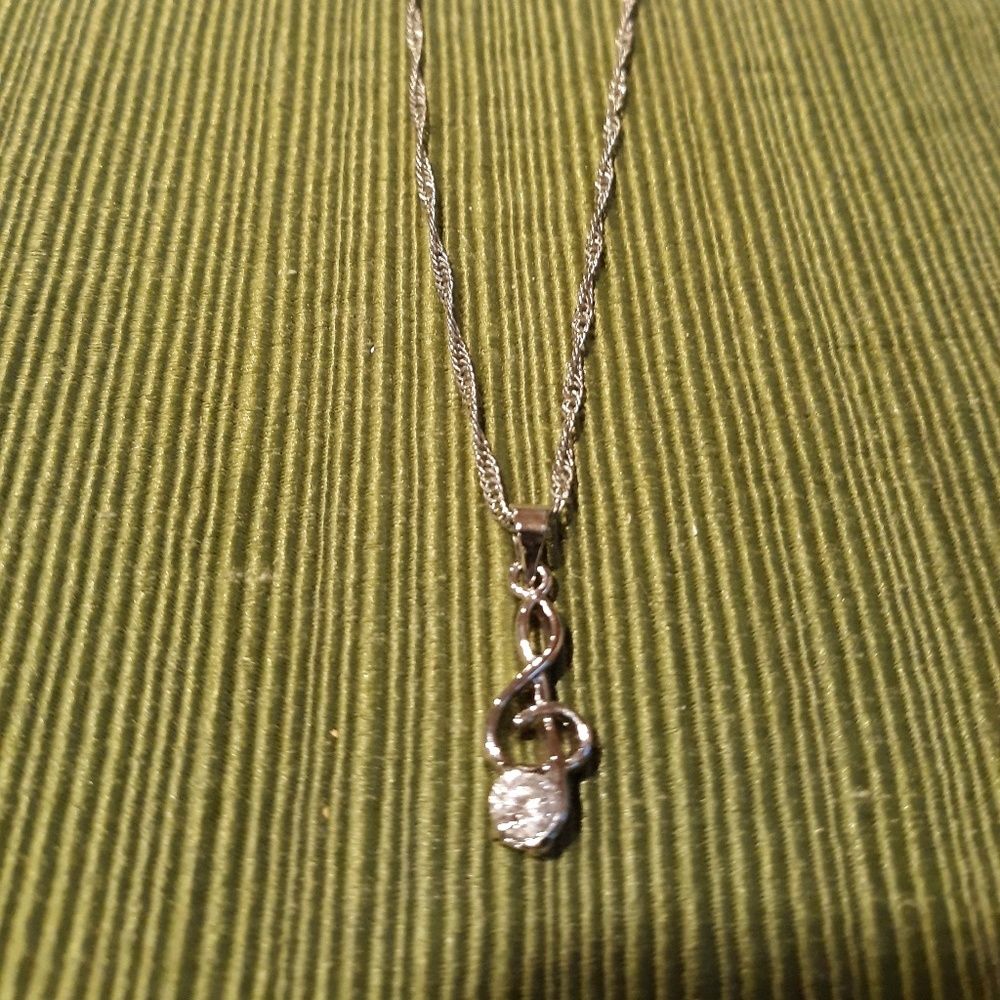 Treble clef necklace with glass stone